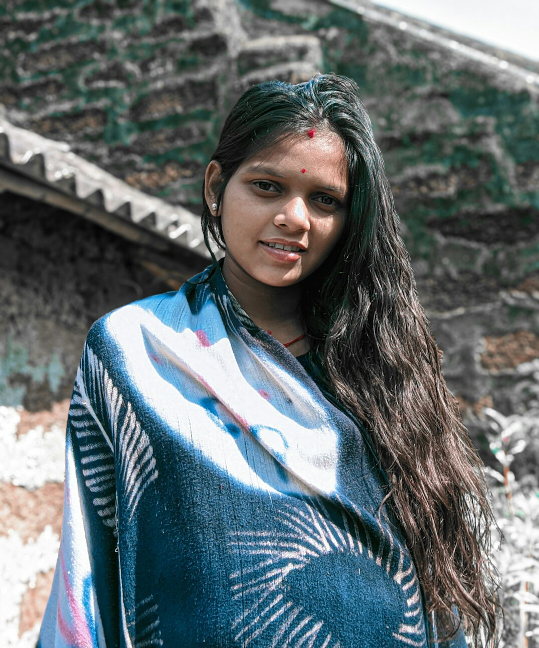 Portrait of a woman with long hair smiling