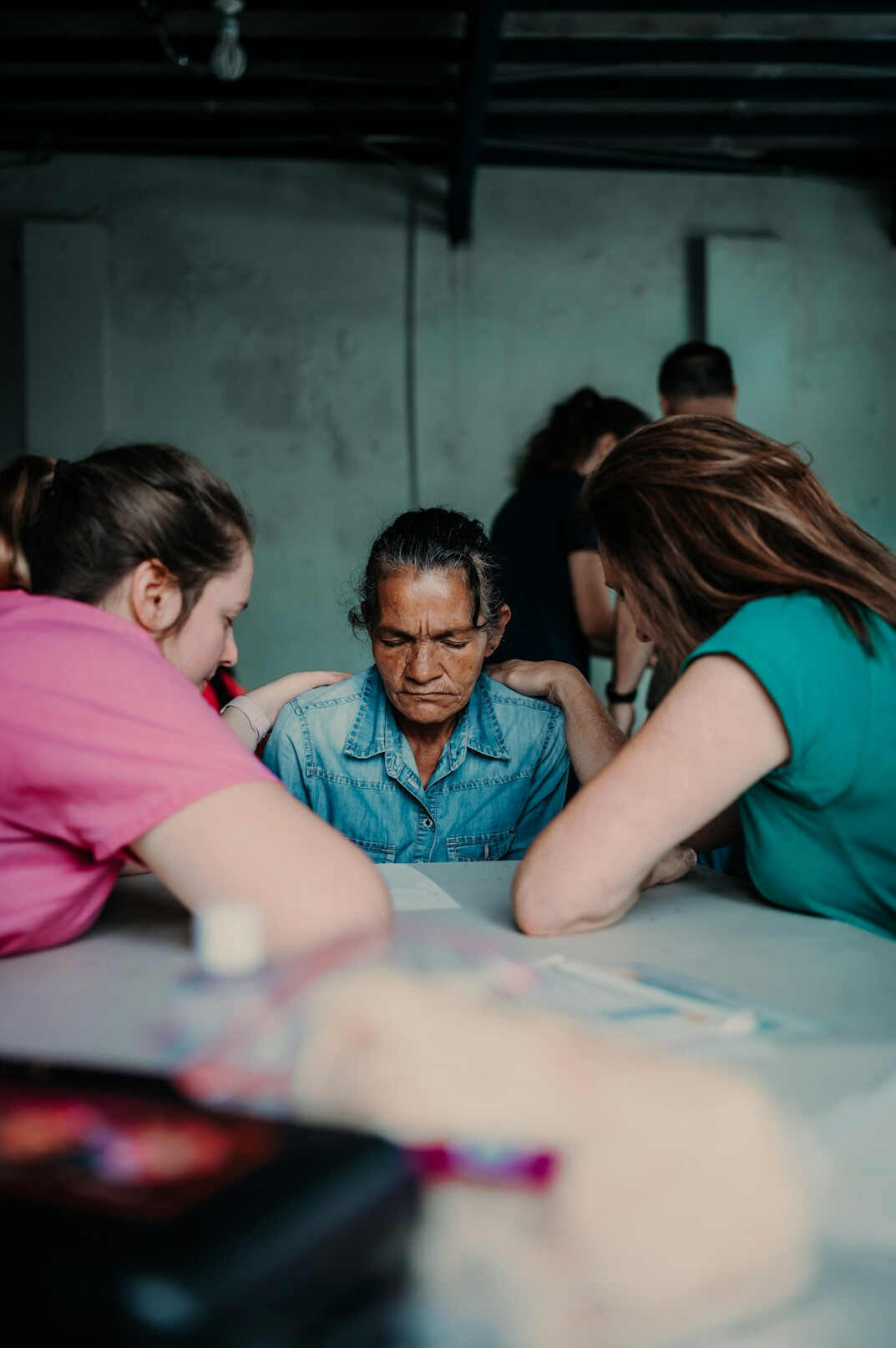 group of adults in classroom discussion